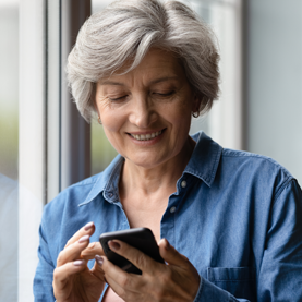 White Oak Dental
pretty woman looking at her phone to contact a dentist